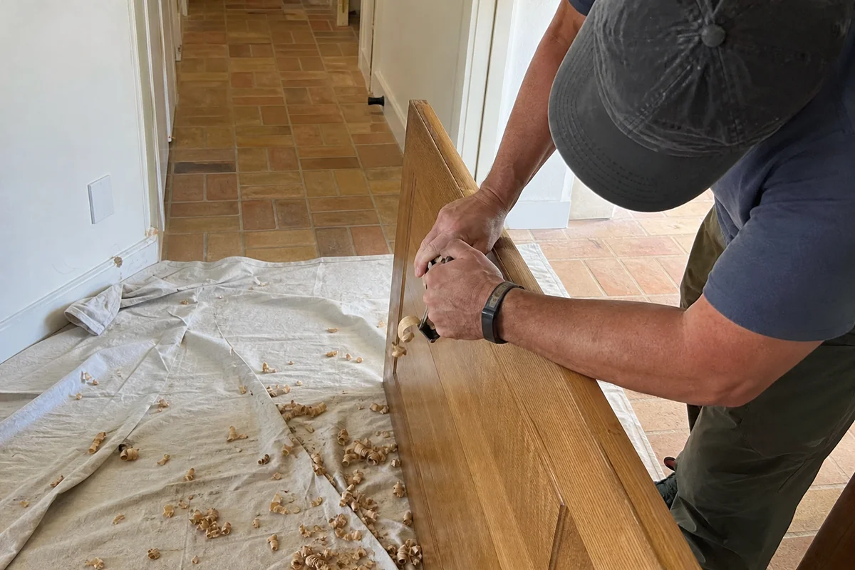 Planing a swollen interior door that sticks at a Malibu home