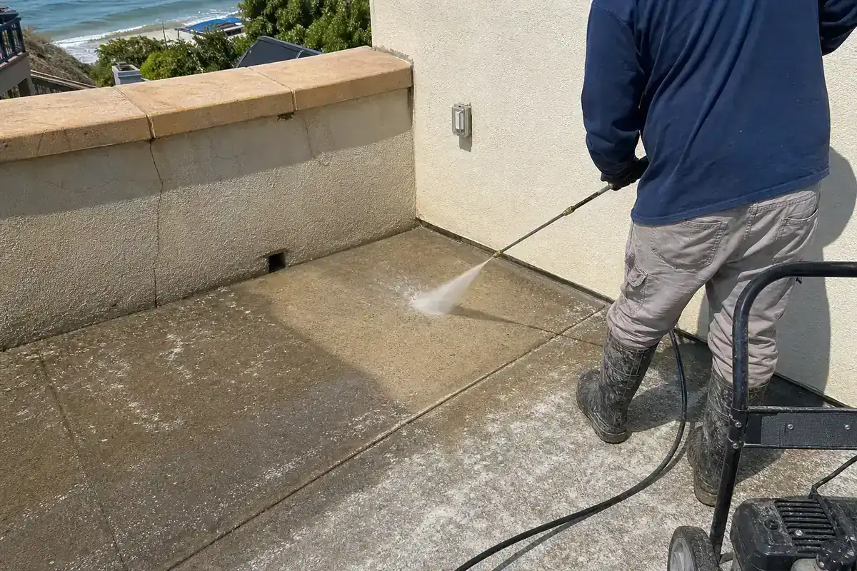 Pressure washing a salt-stained patio at a Malibu home